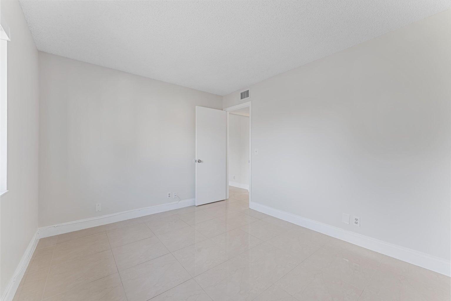 537 Shady Pine Way Greenacres, FL 33415 - Photo 17 of 21 a view of an empty room