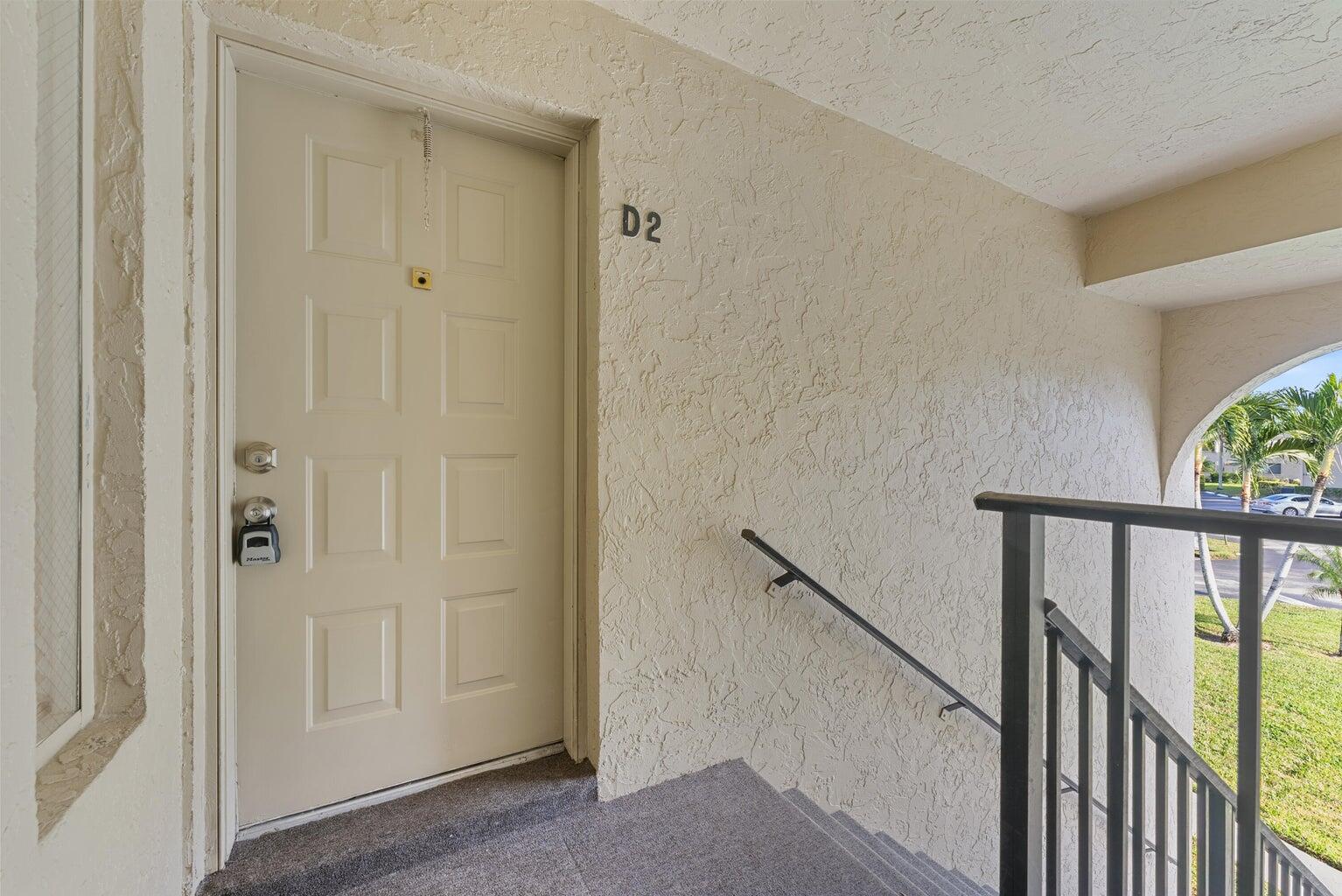 537 Shady Pine Way Greenacres, FL 33415 - Photo 4 of 21 a view of a hallway with wooden floor and entryway