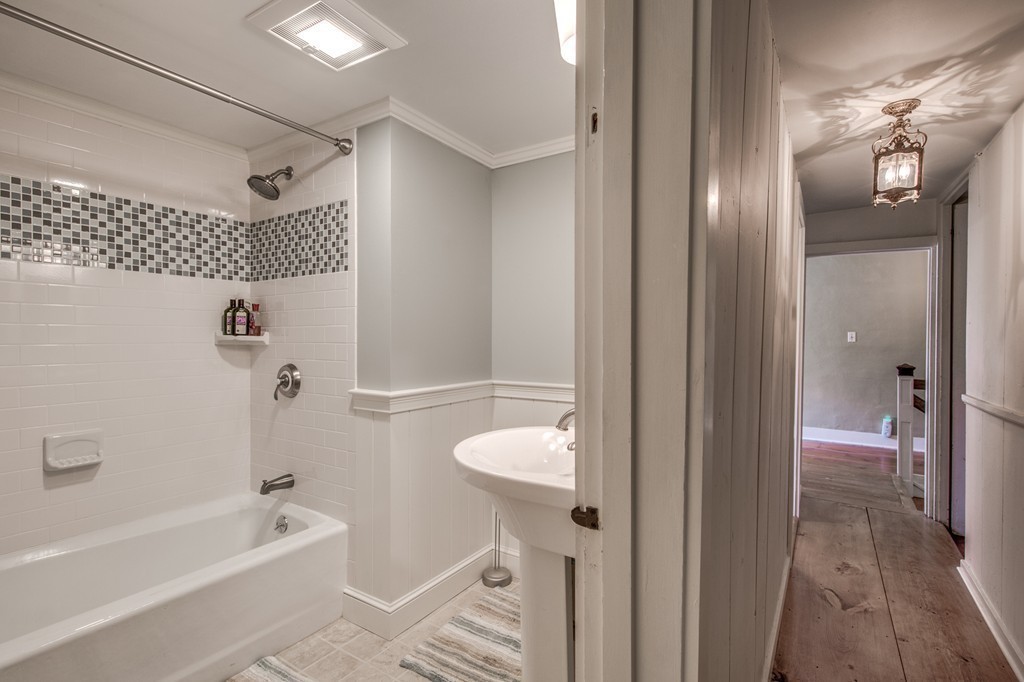 5 East Main Street Hopkinton, MA 01748 - Photo 11 of 20 a bathroom with a tub and shower