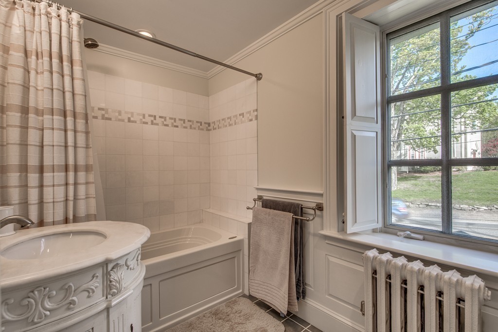 5 East Main Street Hopkinton, MA 01748 - Photo 13 of 20 a bathroom with a granite countertop bathtub sink vanity and toilet
