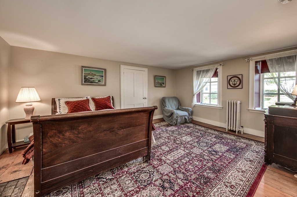 5 East Main Street Hopkinton, MA 01748 - Photo 14 of 20 a living room with furniture a window and a lamp