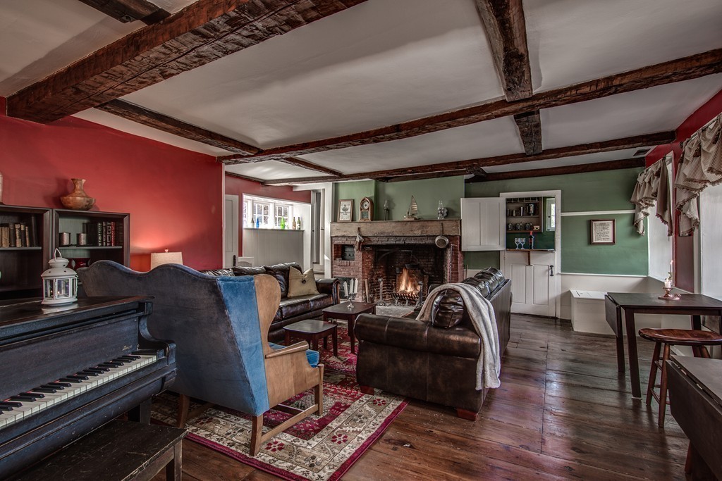 5 East Main Street Hopkinton, MA 01748 - Photo 15 of 20 a living room with furniture and a fireplace