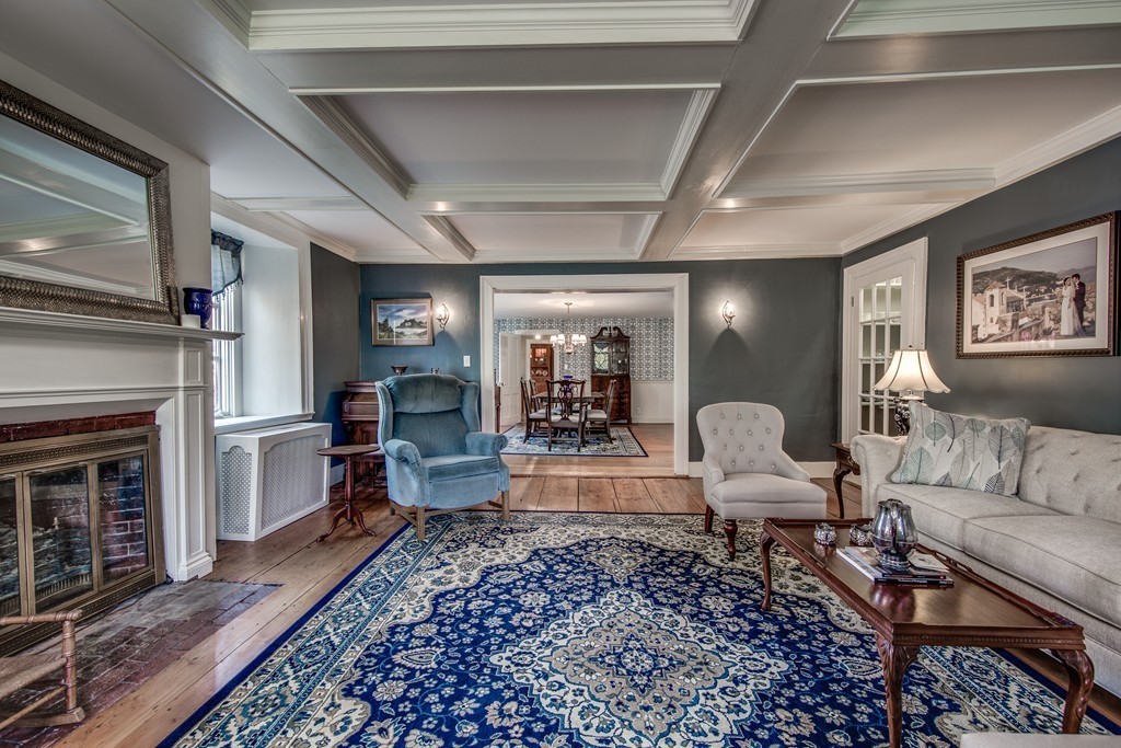 5 East Main Street Hopkinton, MA 01748 - Photo 2 of 20 a living room with furniture and a fireplace