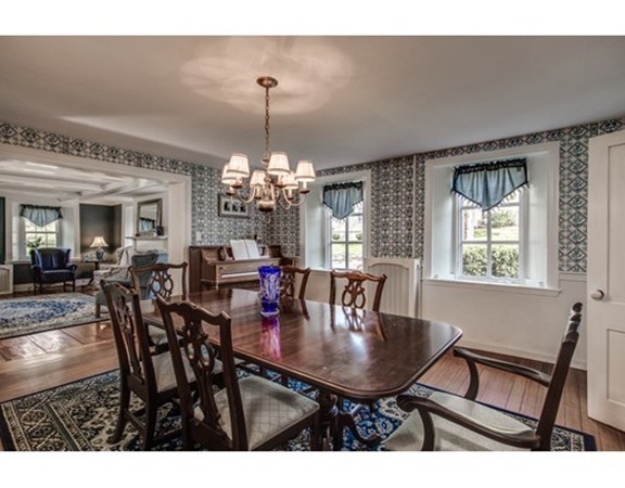 5 East Main Street Hopkinton, MA 01748 - Photo 3 of 20 a view of a dining room with furniture and chandelier