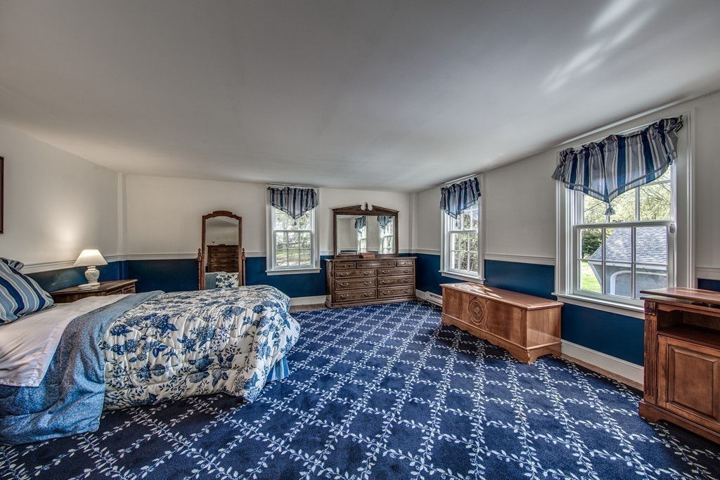 5 East Main Street Hopkinton, MA 01748 - Photo 6 of 20 a bed room with a bed and a window