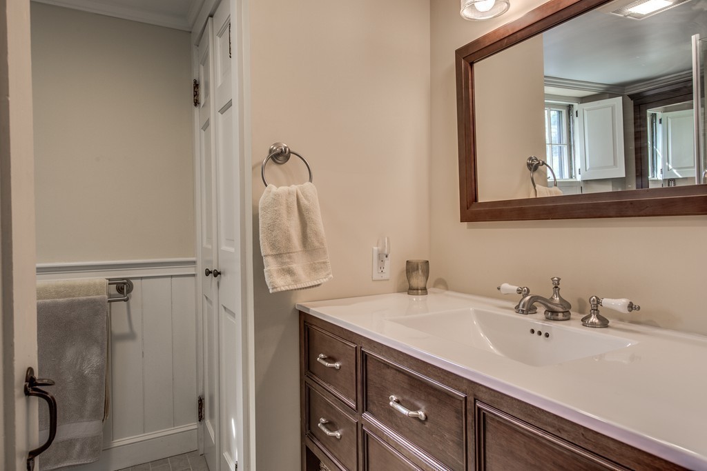 5 East Main Street Hopkinton, MA 01748 - Photo 7 of 20 a bathroom with a sink and a mirror