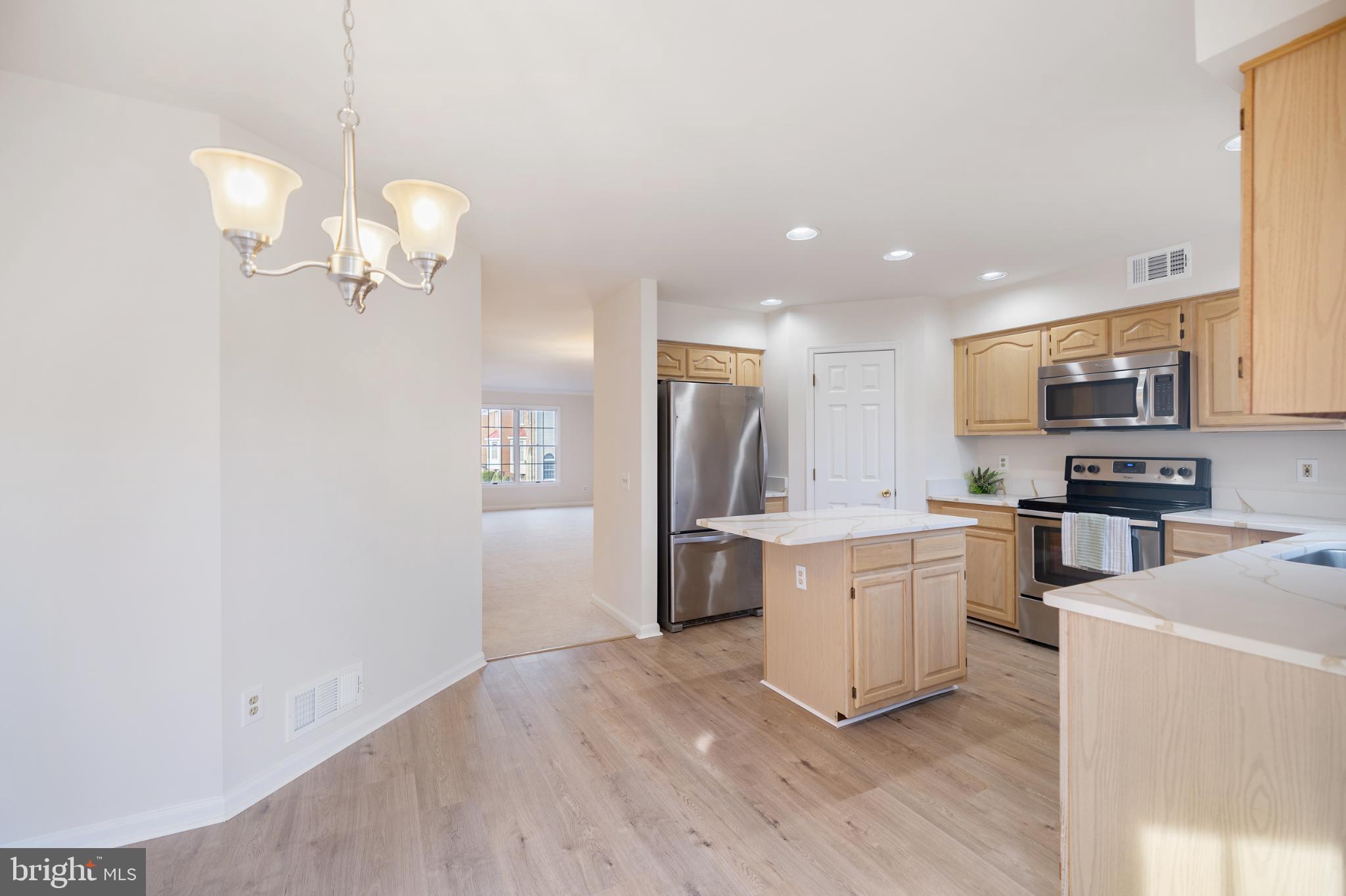 268 St Michaels Circle Odenton, MD 21113 - Photo 13 of 42 a kitchen with a refrigerator a stove top oven a sink dishwasher and wooden floor