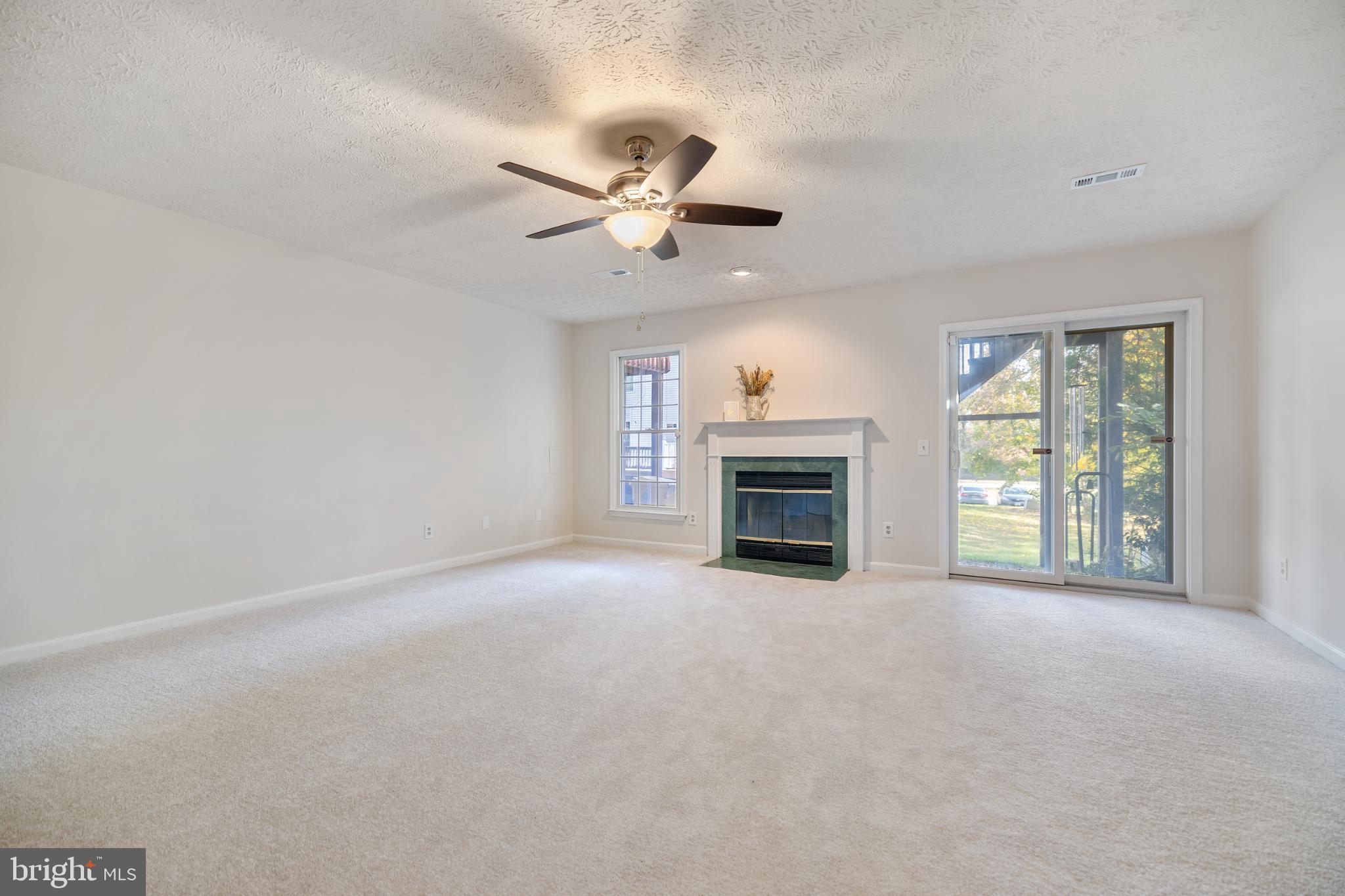 268 St Michaels Circle Odenton, MD 21113 - Photo 26 of 42 an empty room with windows and fireplace
