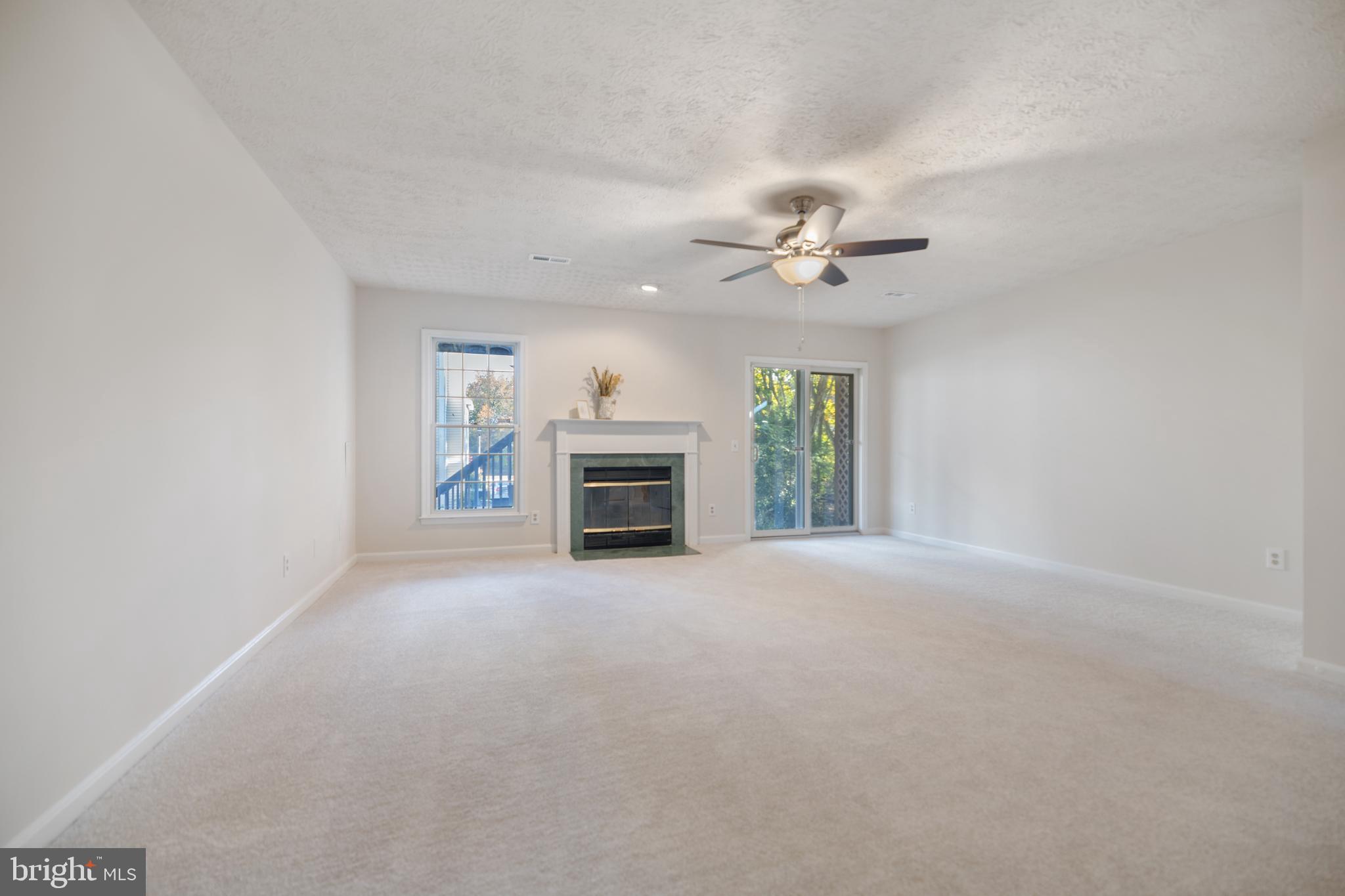 268 St Michaels Circle Odenton, MD 21113 - Photo 27 of 42 an empty room with windows and fireplace