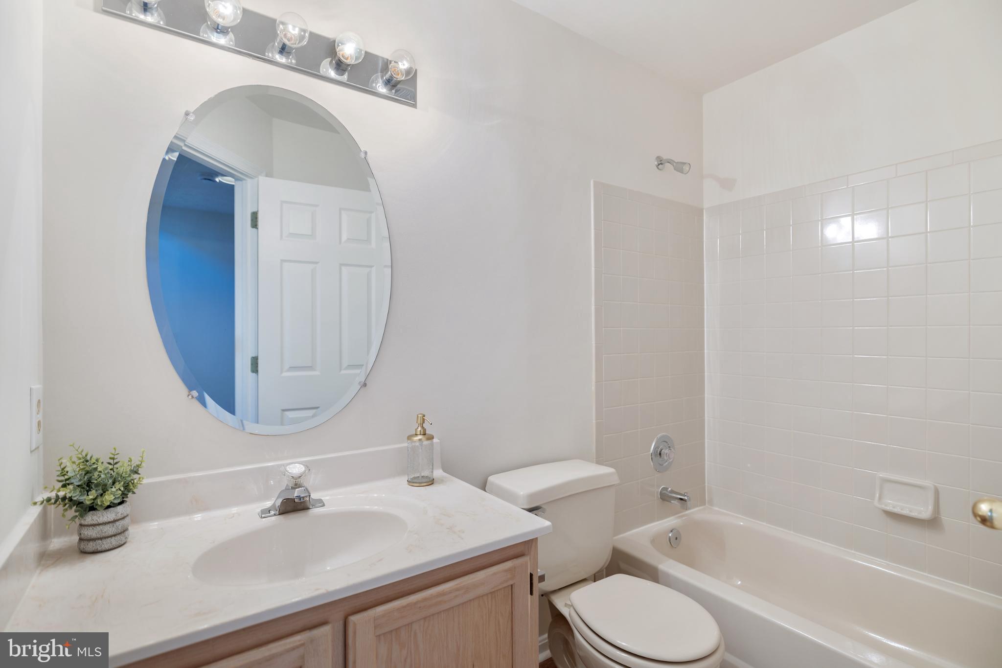 268 St Michaels Circle Odenton, MD 21113 - Photo 31 of 42 a bathroom with a sink toilet and a mirror
