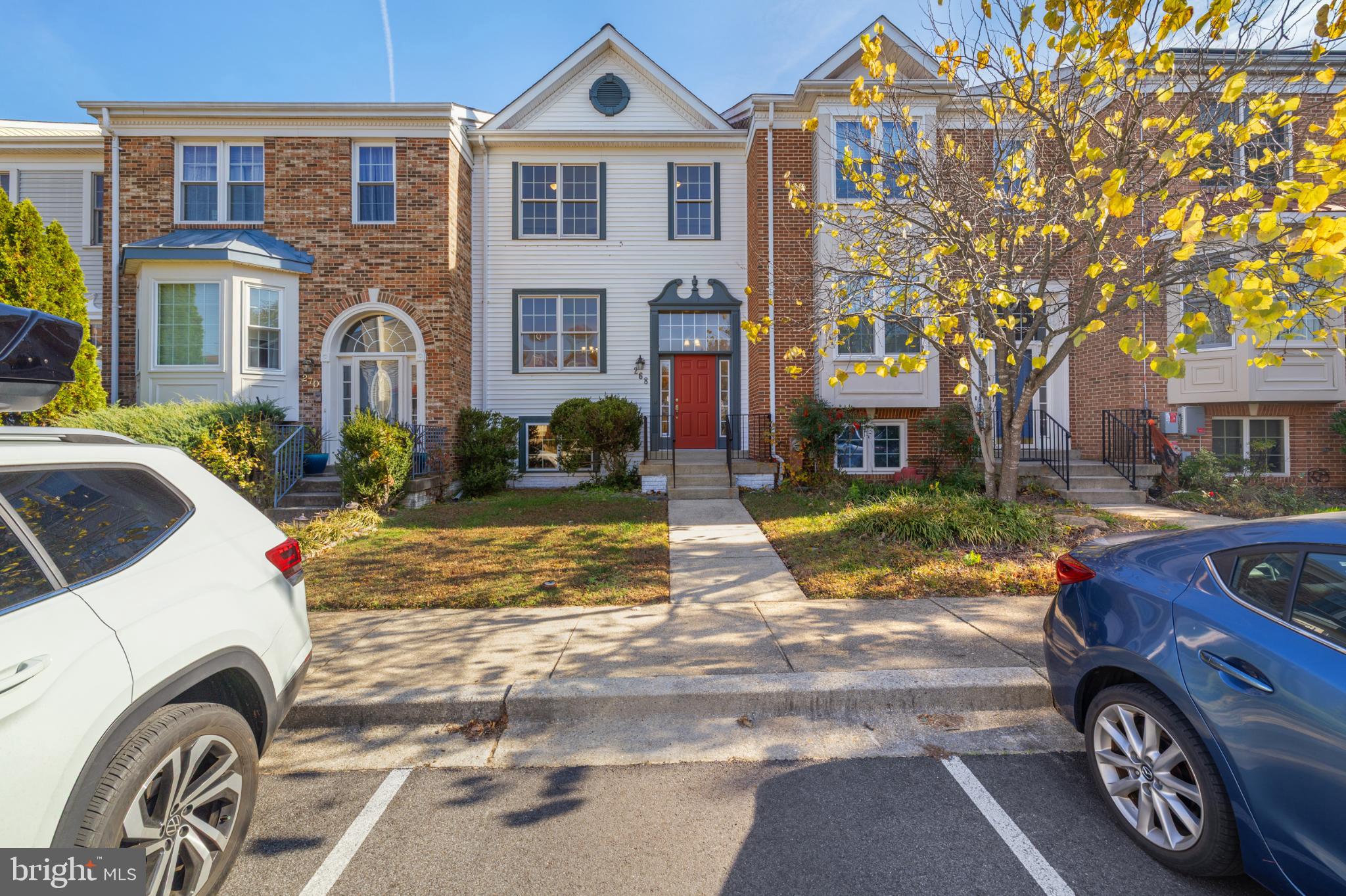268 St Michaels Circle Odenton, MD 21113 - Photo 38 of 42 a view of a car park in front of a brick house with large windows