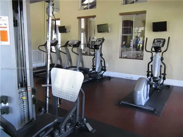 a view of a lake with houses in the back yard