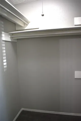 a white toilet and tub sitting next to a bathroom sink
