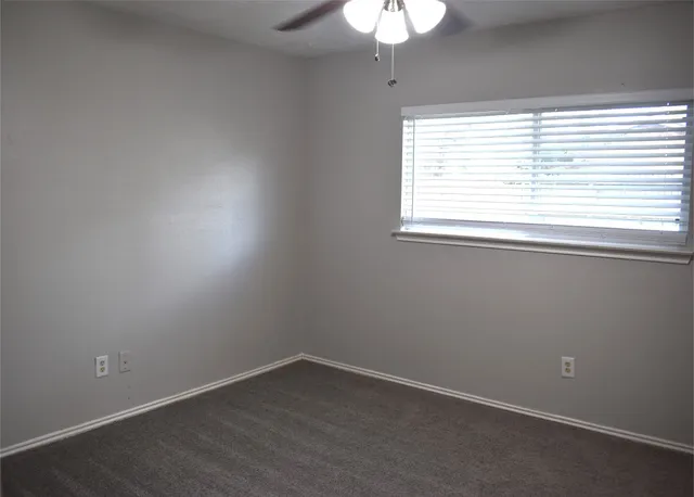 a bathroom with a sink mirror and toilet