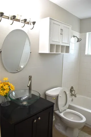 a bathroom with a sink a mirror and a toilet