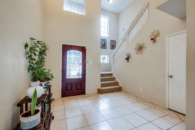 a view of an entryway with wooden floor