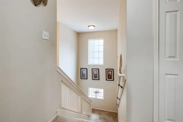 a view of a hallway with windows