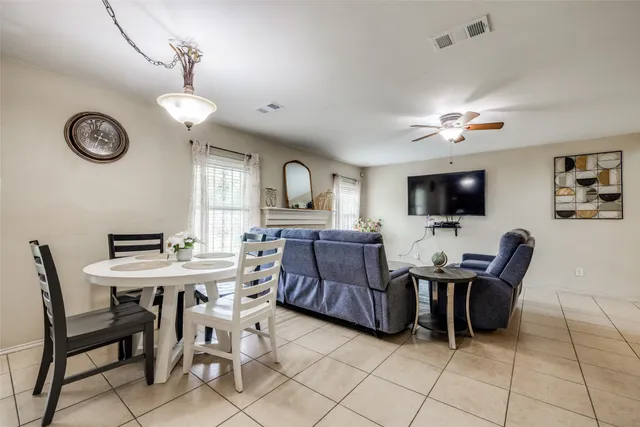 a view of a livingroom with furniture and a flat screen tv