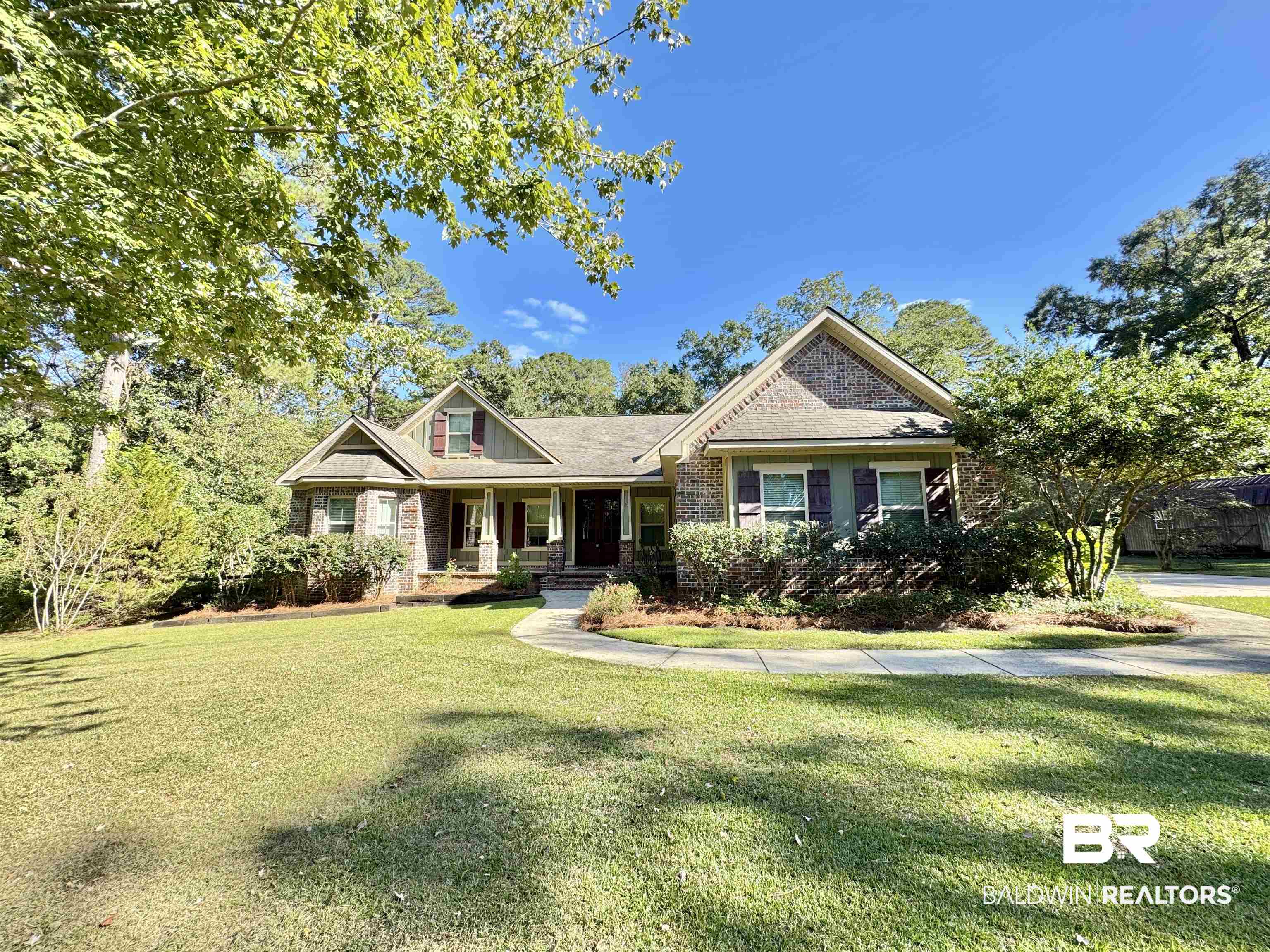10846 County Road 138 Bay Minette, AL 36507 - Photo 14 of 53 Craftsman-style house featuring covered porch and a front lawn