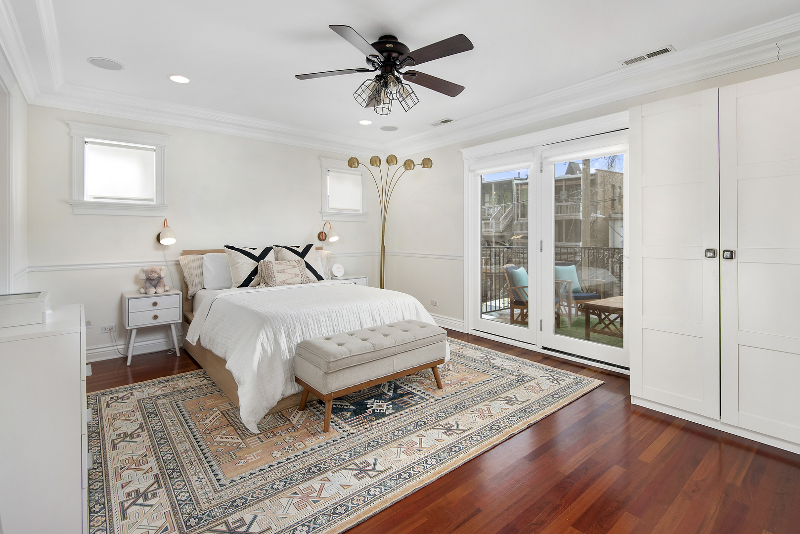 902 West Roscoe Street, Unit 2 Chicago, IL 60657 - Photo 9 of 14 a bedroom with a bed and a chandelier
