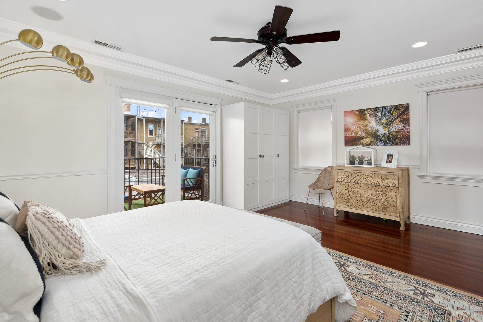 902 West Roscoe Street, Unit 2 Chicago, IL 60657 - Photo 10 of 14 a bedroom with a large bed and a chandelier