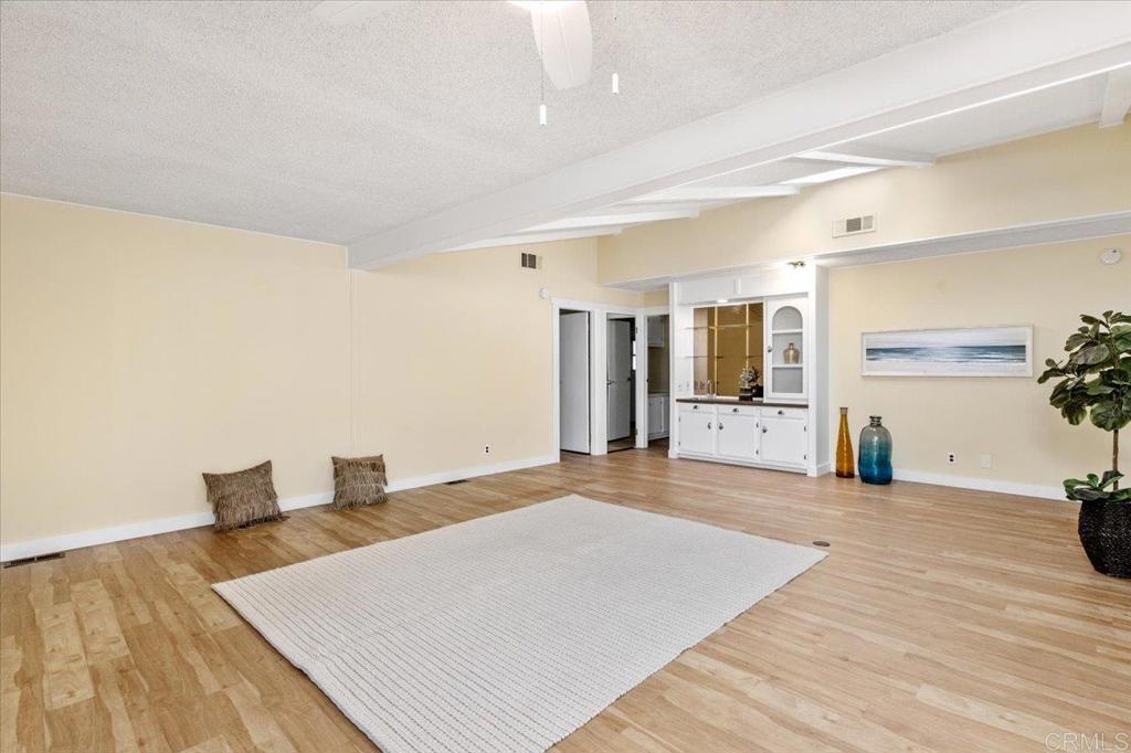 18218 Paradise Mountain Road, Unit SPC 206 Valley Center, CA 92082 - Photo 13 of 43 a large room with a table and chairs