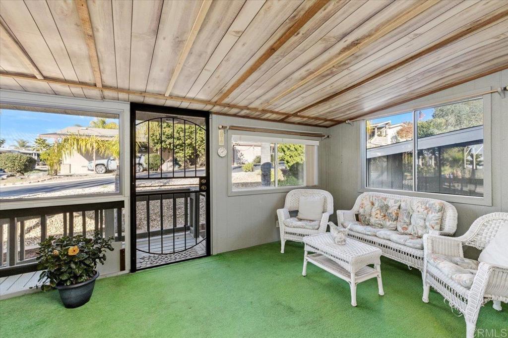 18218 Paradise Mountain Road, Unit SPC 206 Valley Center, CA 92082 - Photo 17 of 43 a bedroom with furniture and a large window