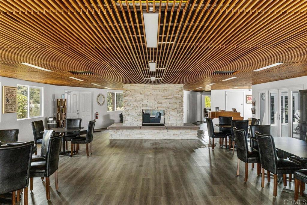 18218 Paradise Mountain Road, Unit SPC 206 Valley Center, CA 92082 - Photo 36 of 43 a living room with furniture and a fireplace