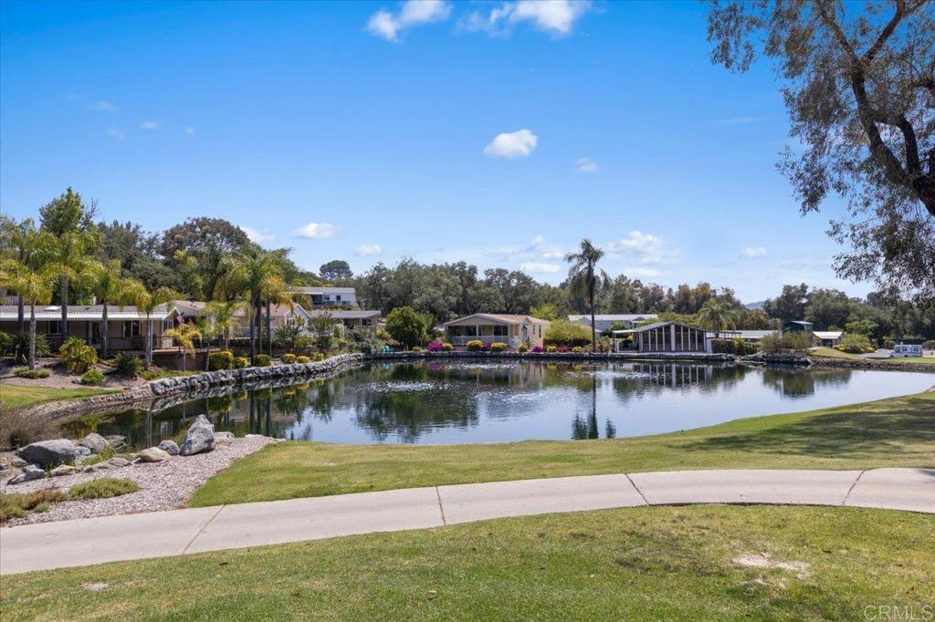 18218 Paradise Mountain Road, Unit SPC 206 Valley Center, CA 92082 - Photo 42 of 43 a view of a lake with houses
