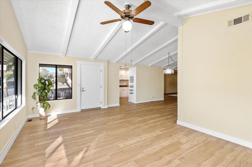 18218 Paradise Mountain Road, Unit SPC 206 Valley Center, CA 92082 - Photo 6 of 43 a view of a livingroom with a ceiling fan and window