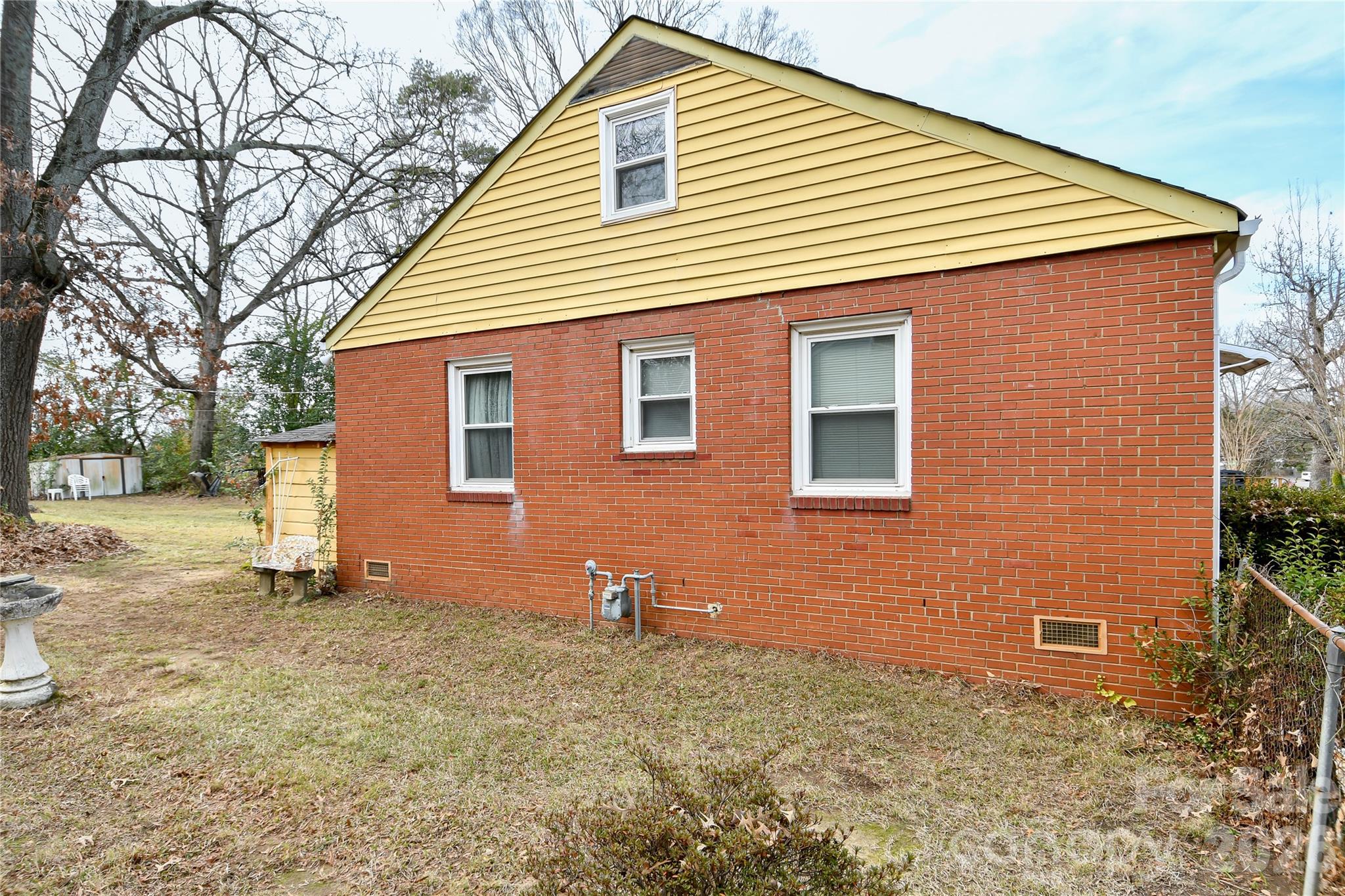 531 Bowman Road Charlotte, NC 28217 - Photo 6 of 10 a view of a house with a backyard