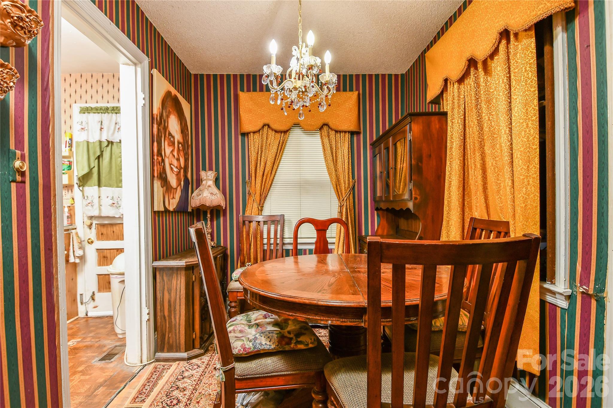 531 Bowman Road Charlotte, NC 28217 - Photo 8 of 10 a dining room with furniture chandelier