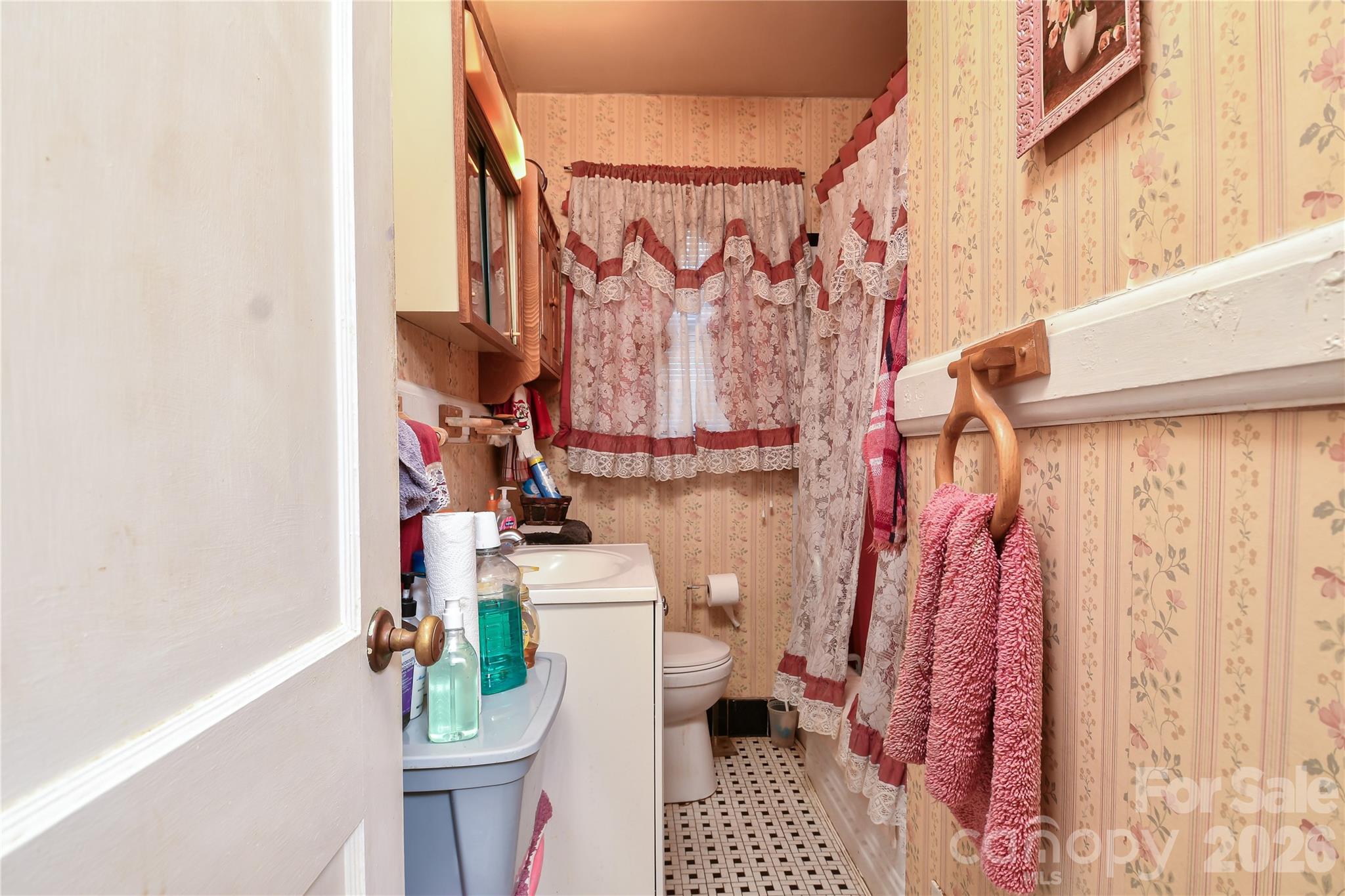 531 Bowman Road Charlotte, NC 28217 - Photo 9 of 10 a bathroom with a sink toilet and shower curtain