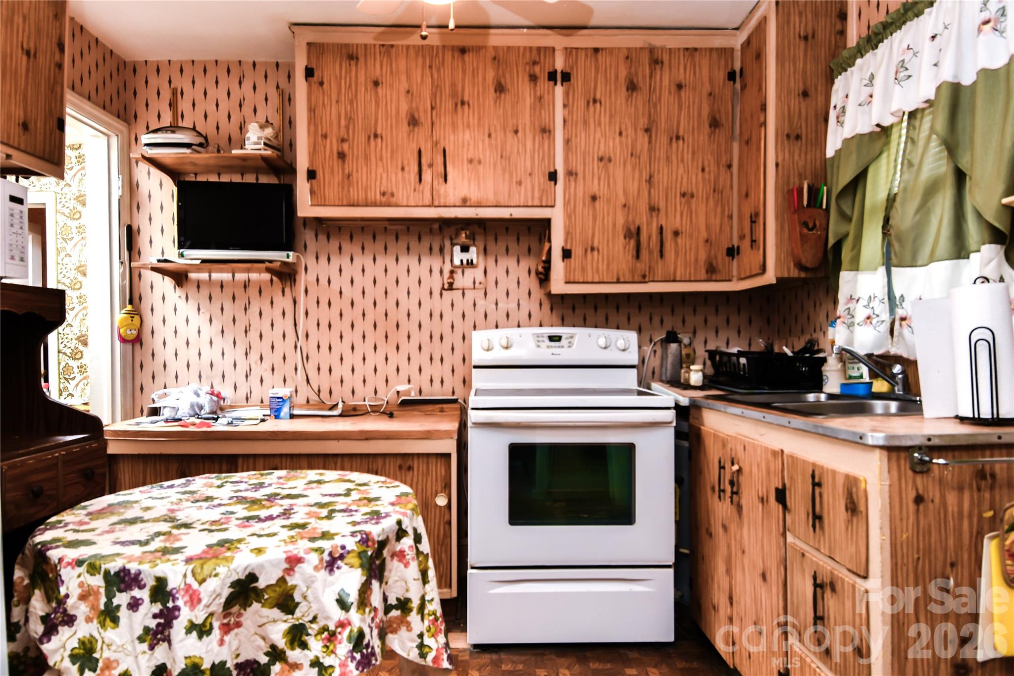 531 Bowman Road Charlotte, NC 28217 - Photo 10 of 10 a kitchen with stainless steel appliances granite countertop a stove and a sink