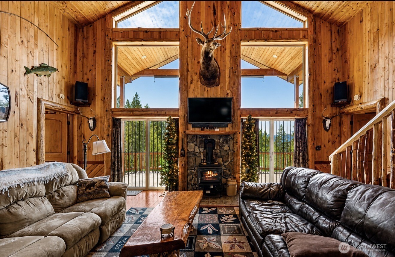 0 Boyd Road Randle, WA 98377 - Photo 4 of 39 a living room with furniture a floor to ceiling window and shower