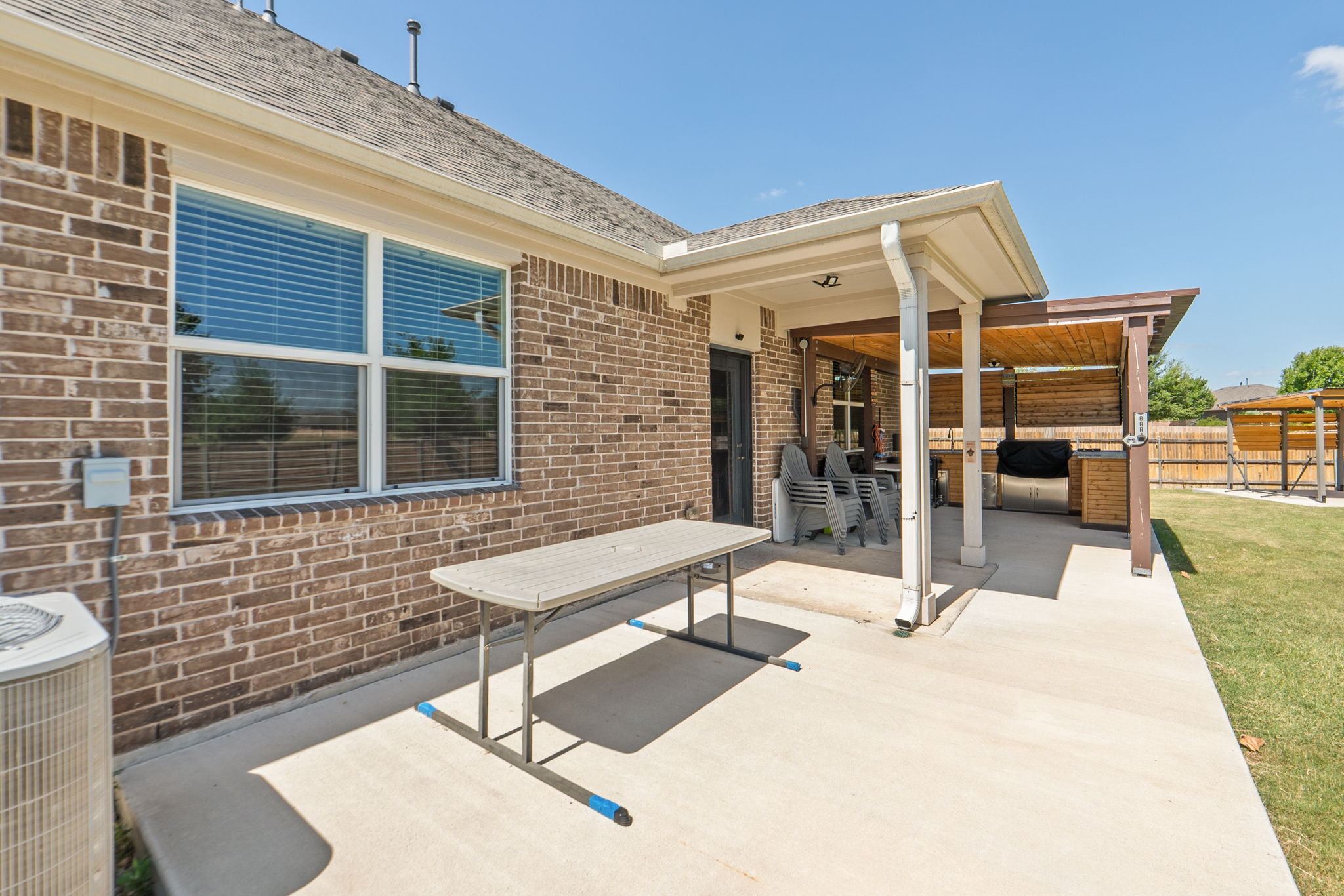 142 Brunnen Way Georgetown, TX 78626 - Photo 18 of 22 A spacious backyard patio provides ample room for outdoor entertaining and enjoyment.