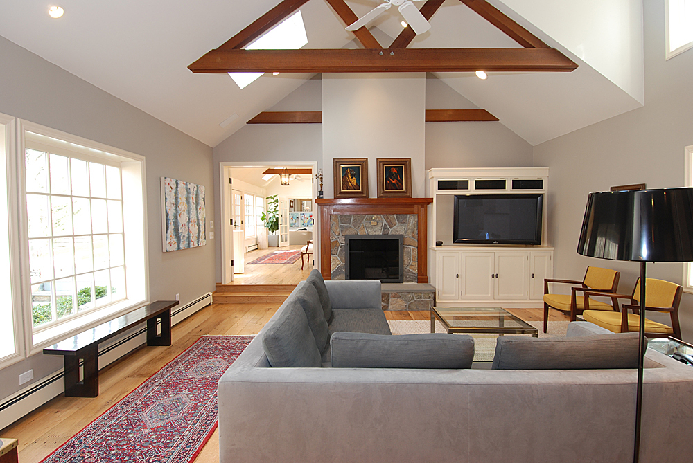 449 Valley Road New Canaan, CT 06840 - Photo 12 of 19 a living room with furniture a flat screen tv and a fireplace