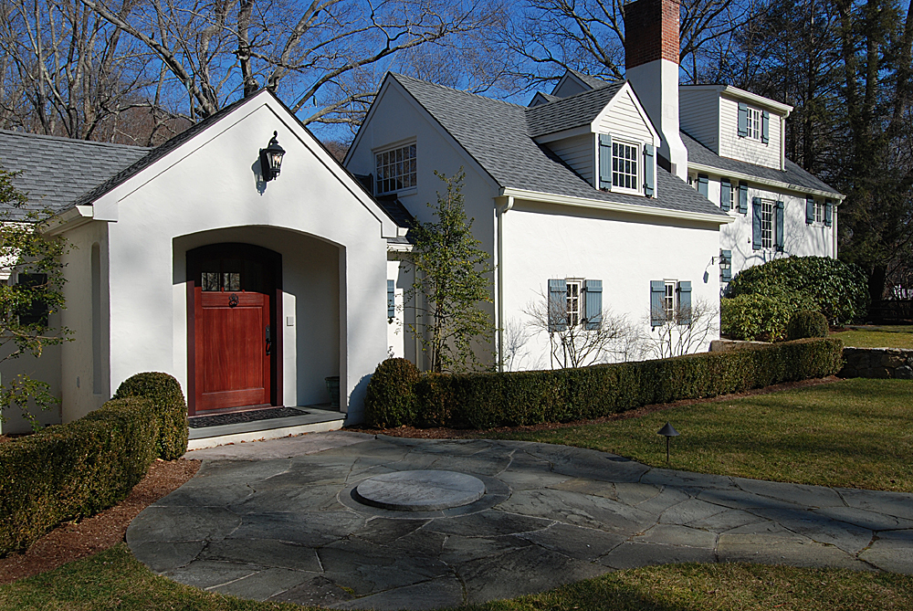 449 Valley Road New Canaan, CT 06840 - Photo 18 of 19 a front view of a house with garden
