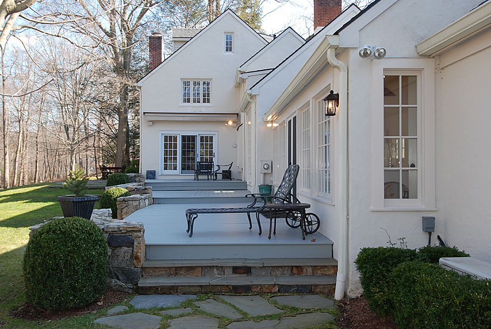 449 Valley Road New Canaan, CT 06840 - Photo 4 of 19 a view of a house with couches and a fire pit