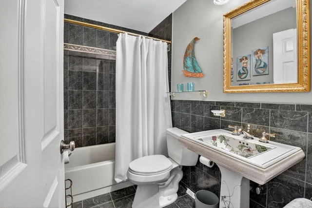 a bed room with a bed and a chandelier