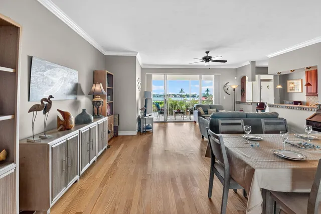 a dining room with furniture and wooden floor