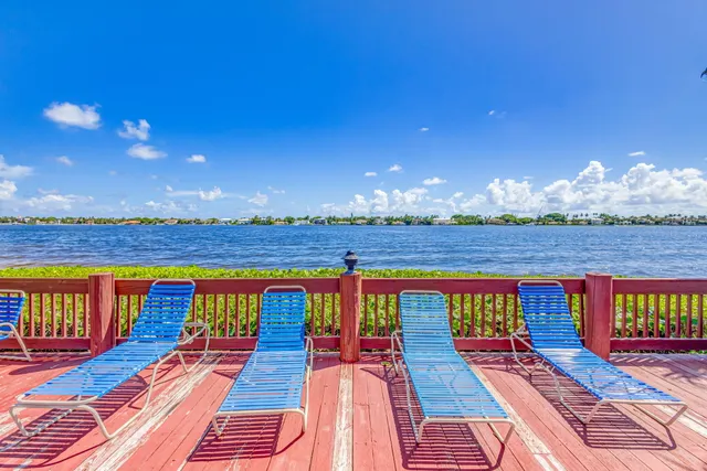 a view of a patio with a table and chairs