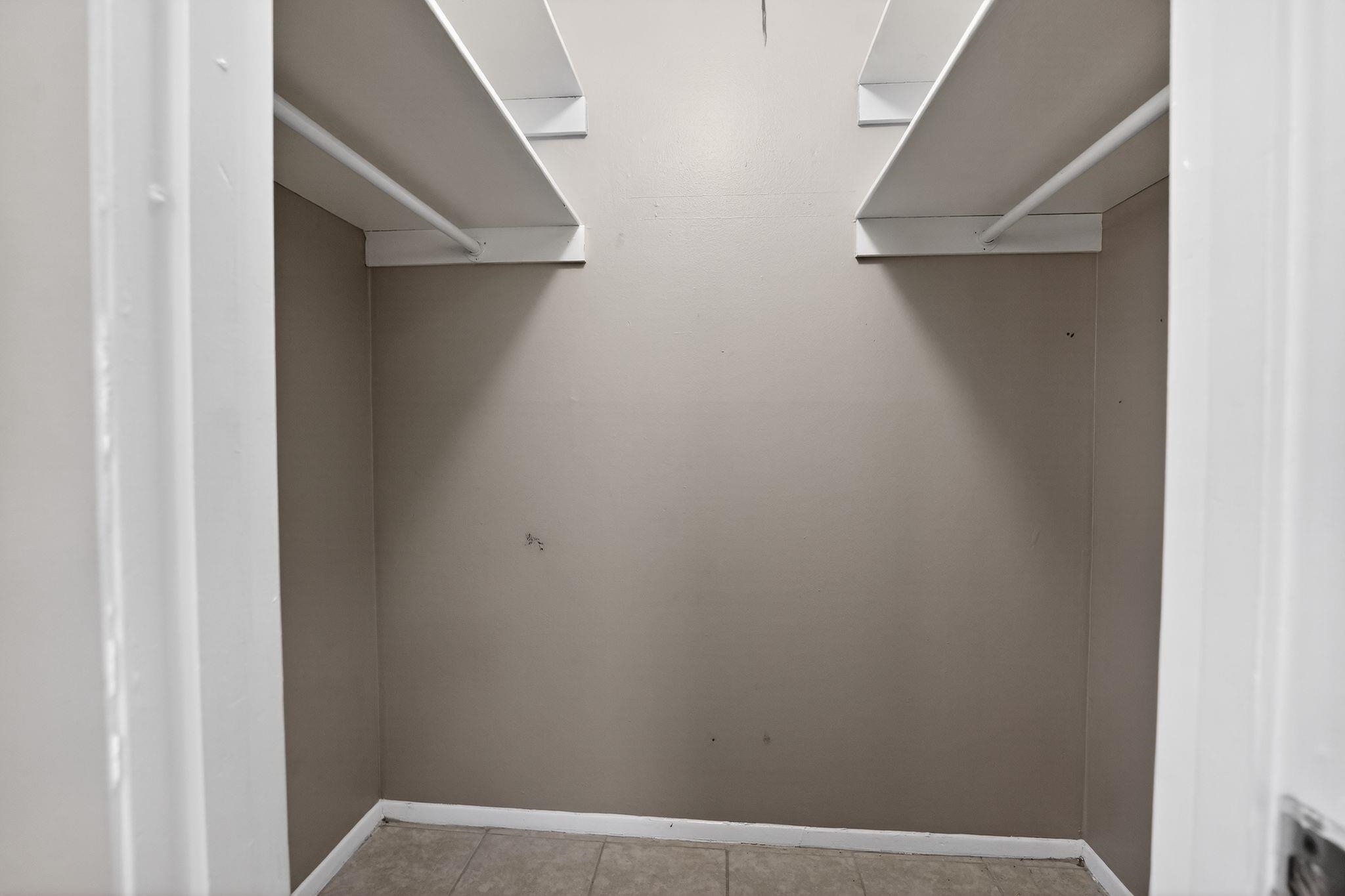 4828 Knight Arnold Road Memphis, TN 38118 - Photo 18 of 24 Walk in closet with light tile patterned floors