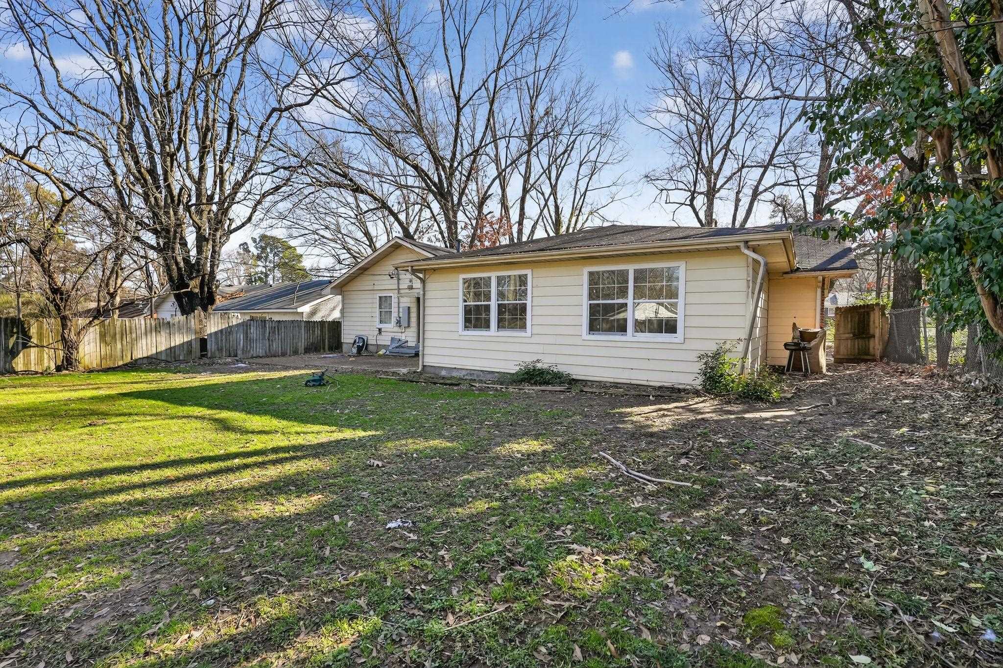 4828 Knight Arnold Road Memphis, TN 38118 - Photo 22 of 24 Back of property with a fenced backyard and a patio area