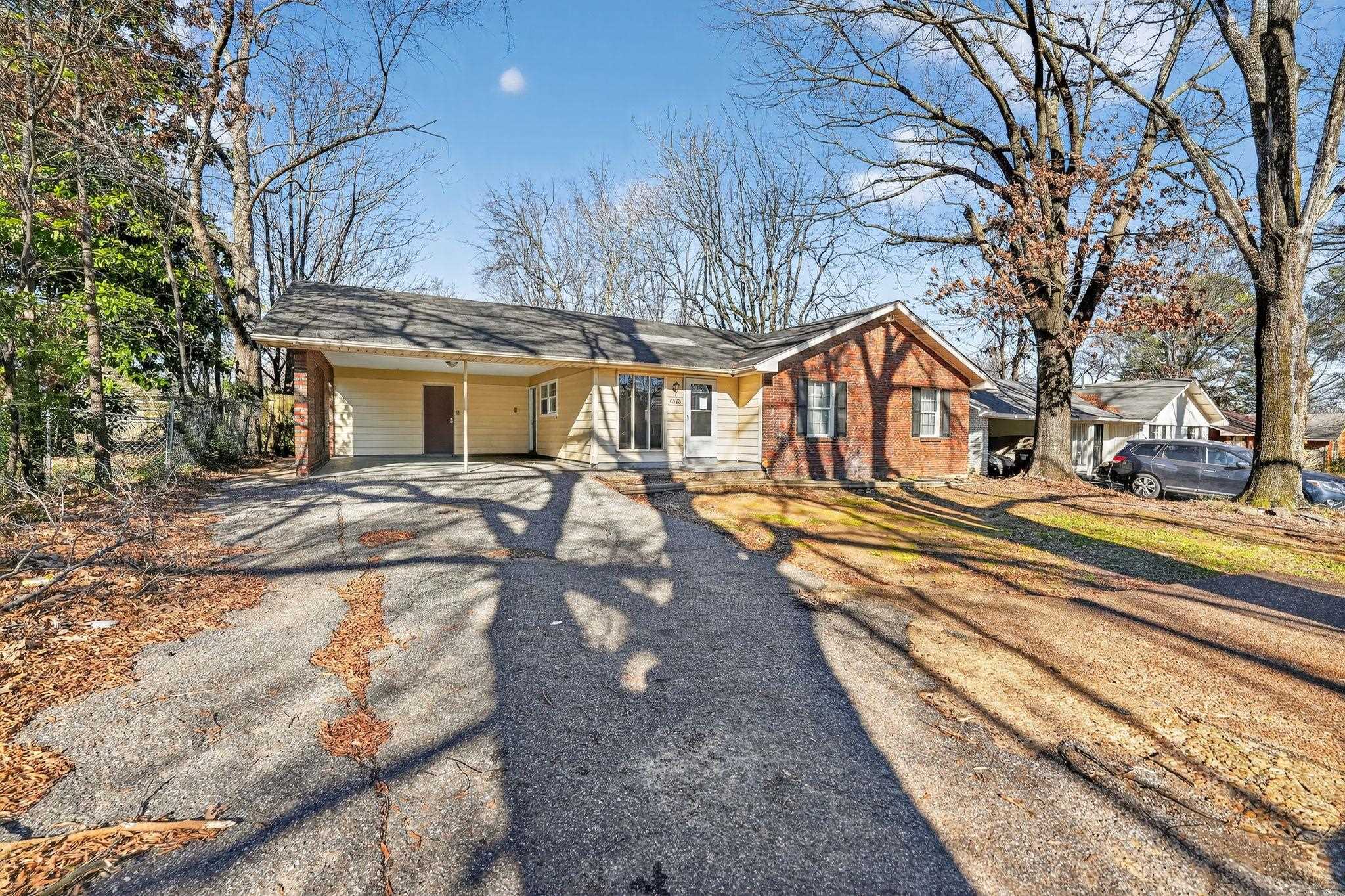 4828 Knight Arnold Road Memphis, TN 38118 - Photo 3 of 24 Ranch-style house with asphalt driveway and an attached carport
