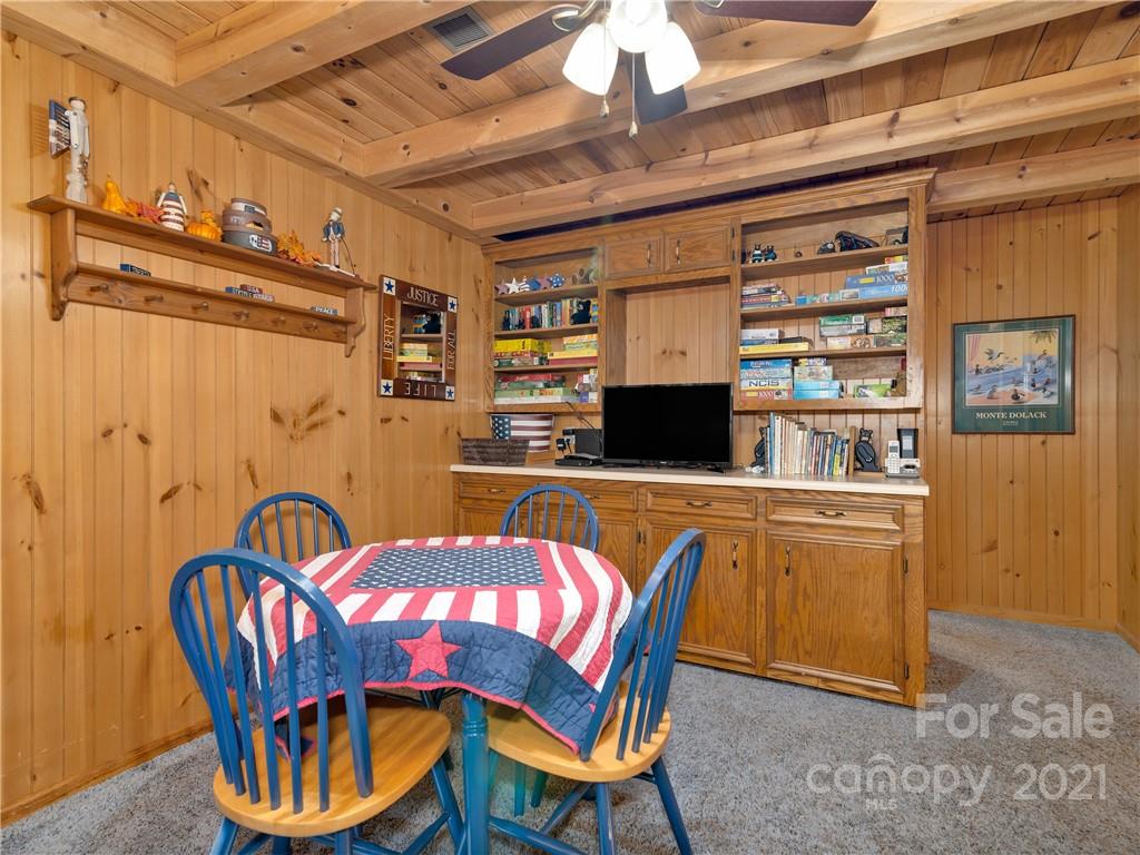 357 Reuben Branch Road Maggie Valley, NC 28751 - Photo 22 of 32 a view of a dining room with furniture