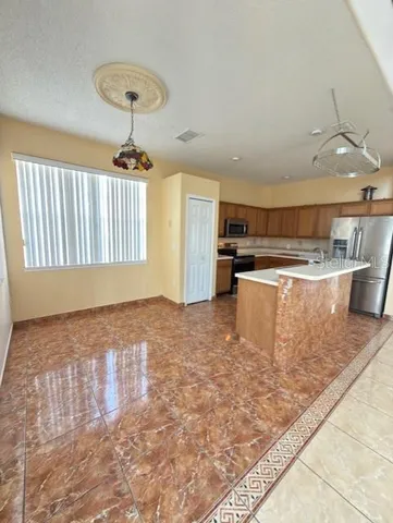 a view of a kitchen with a sink