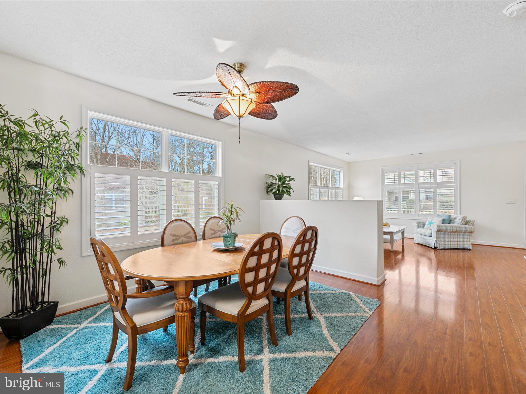 4 Cromwell Drive Ocean View, DE 19970 - Photo 11 of 59 a dining room with furniture a chandelier and wooden floor