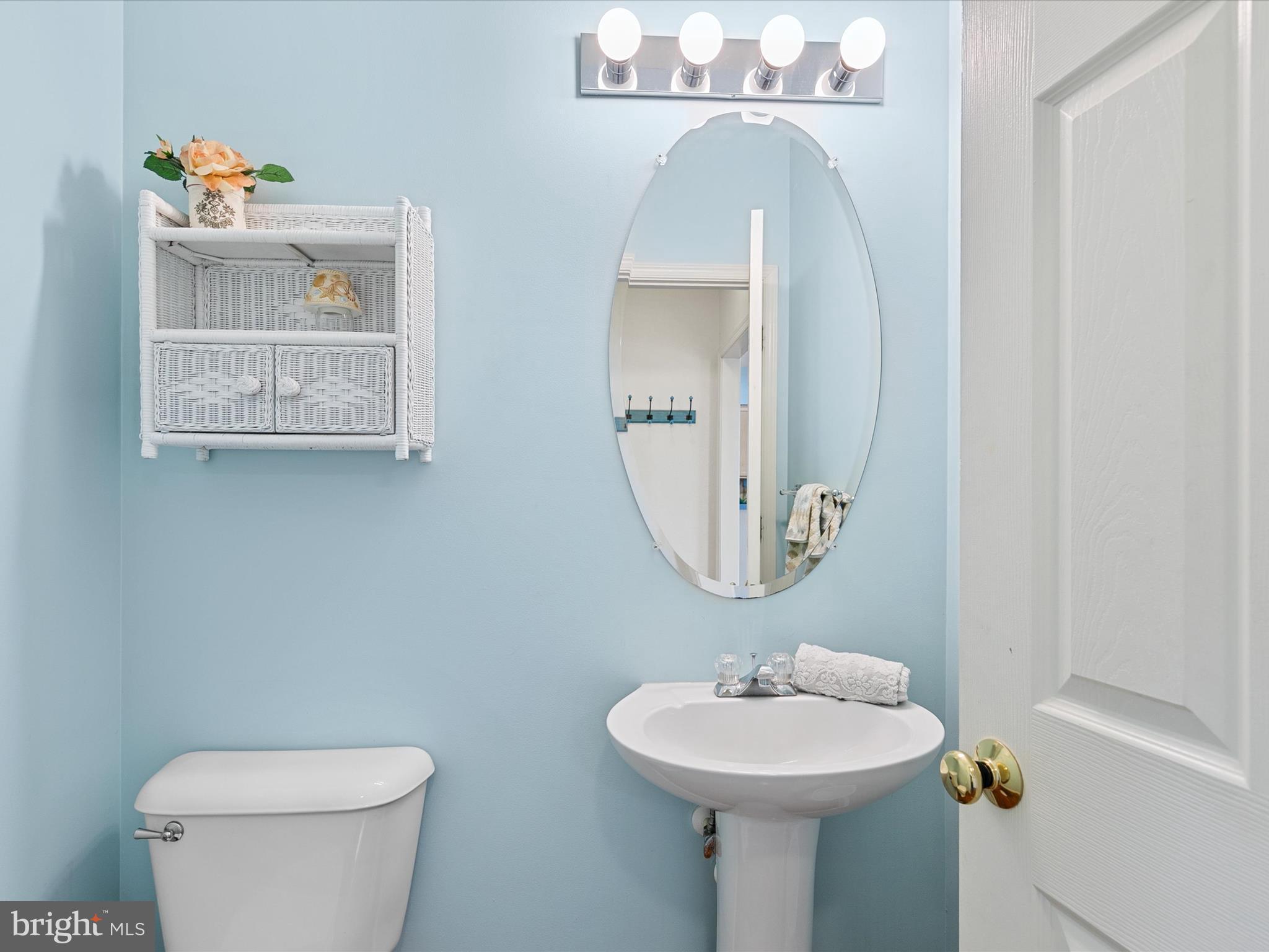 4 Cromwell Drive Ocean View, DE 19970 - Photo 23 of 59 a bathroom with a toilet sink and mirror