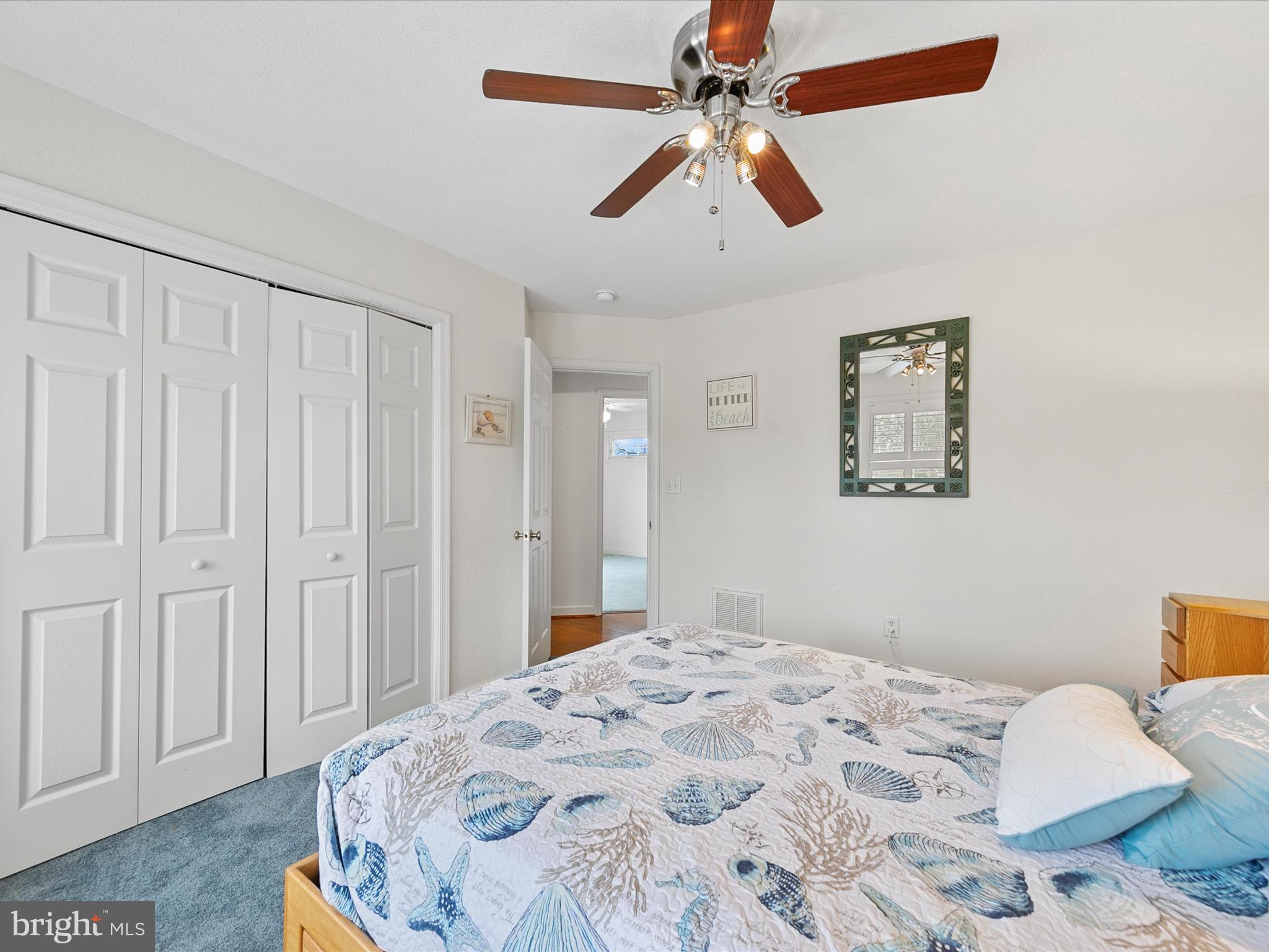 4 Cromwell Drive Ocean View, DE 19970 - Photo 33 of 59 a bedroom with a bed and a chandelier